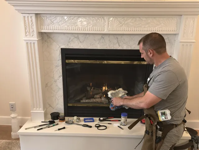 Abington Chimney Sweep performing fireplace maintenance in Abington, MA