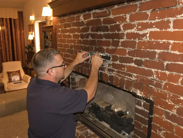 Abington Chimney Sweep expert fixing a fireplace in Abington, MA